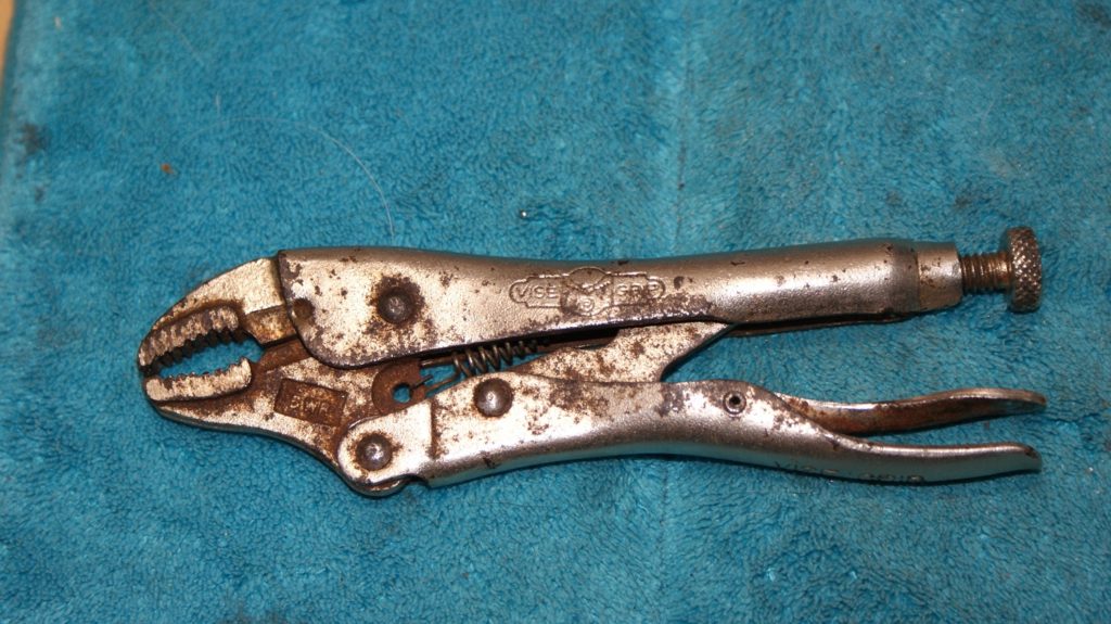 Locking Pliers - vice grips used to remove small strip screws